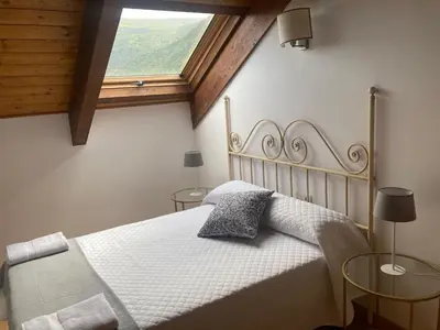 Cama o camas de una habitación en AT Refugio del Pirineo