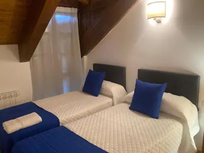 Cama o camas de una habitación en AT Refugio del Pirineo