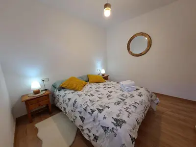 Cama o camas de una habitación en LA GINESTA 3, Apartaments de muntanya