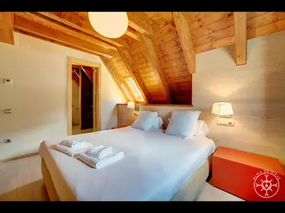 Cama o camas de una habitación en CASA ARROQUETS de Alma de Nieve