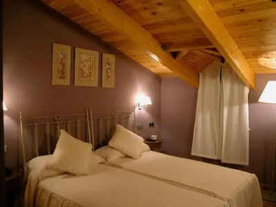 Cama o camas de una habitación en Hotel Villa de Estercuel