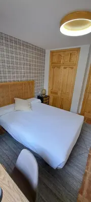 Cama o camas de una habitación en SNÖ Apartamentos Escarrilla