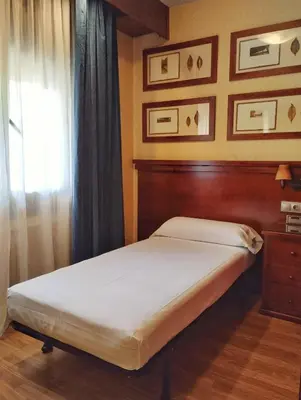 Cama o camas de una habitación en Hostal Los Infantes