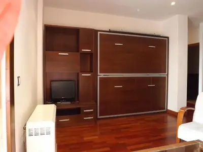 Una televisión o centro de entretenimiento en Roca Nevada Suites