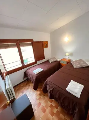 Cama o camas de una habitación en Casa Teto, ideal famílies i grups