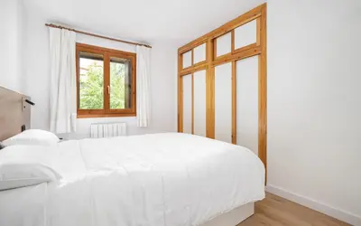 Cama o camas de una habitación en La gran plaza de candanchu