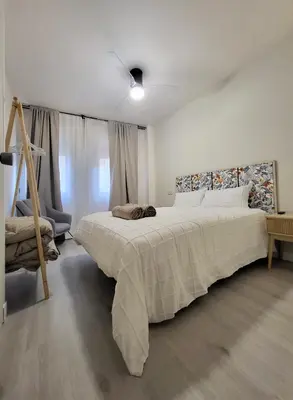 Cama o camas de una habitación en Apartamentos Crispín Candela