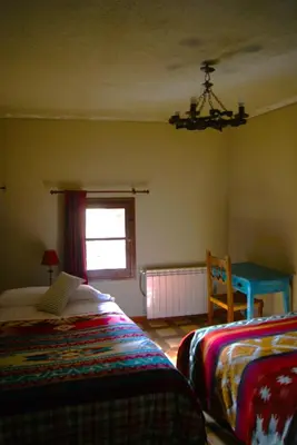 Cama o camas de una habitación en Ave Fénix