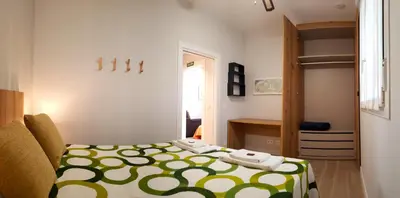 Cama o camas de una habitación en Apartamentos Meson del Barro - Alojamientos Pamplona