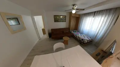 Una televisión o centro de entretenimiento en Apartamentos Meson del Barro - Alojamientos Pamplona
