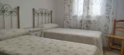 Cama o camas de una habitación en Apartamento EL RIO
