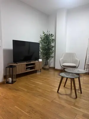 Una televisión o centro de entretenimiento en Atico con vistas al Mercado Central Opcion de parking