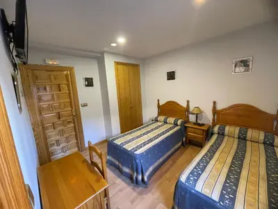 Cama o camas de una habitación en Pensión El Gallo