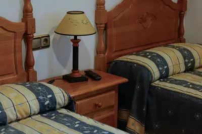 Cama o camas de una habitación en Pensión El Gallo