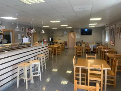 Un restaurante o sitio para comer en HOSPEDERIA EL CORTIJo