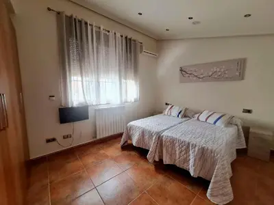Cama o camas de una habitación en Casas Rurales Peña Flor 8