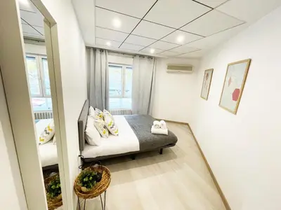 Cama o camas de una habitación en Novedad Avenida puente del Pilar