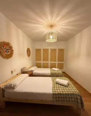 Cama o camas de una habitación en Arafita, cálido y familiar - Arafita Apartamentos