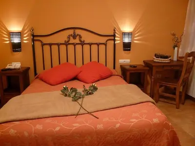 Cama o camas de una habitación en Complejo Turístico Bielsa Hotel y camping