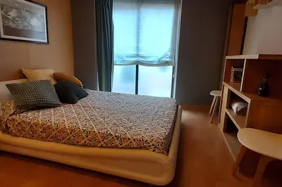 Cama o camas de una habitación en Estudio de diseño con parking en el centro