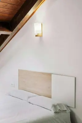 Cama o camas de una habitación en LINA by Cardi Suites.