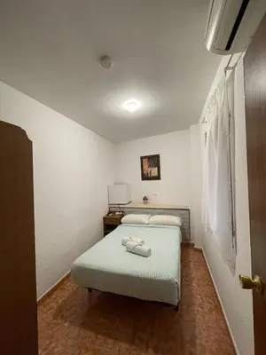 Cama o camas de una habitación en Pensión Fortea