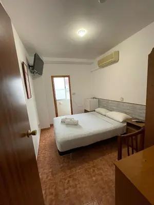 Cama o camas de una habitación en Pensión Fortea