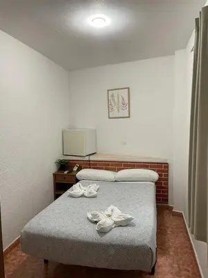 Cama o camas de una habitación en Pensión Fortea