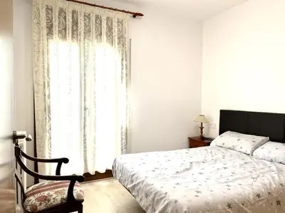 Cama o camas de una habitación en Apartament cèntric amb terrassa i balcó by RURAL D'ÀNEU