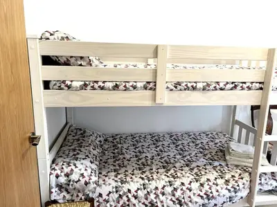 Cama o camas de una habitación en Apartament cèntric amb terrassa i balcó by RURAL D'ÀNEU