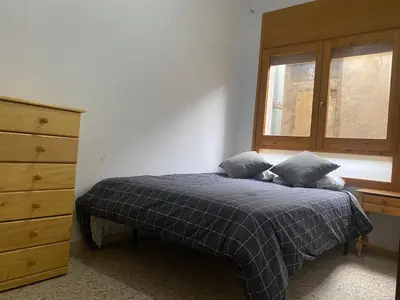 Cama o camas de una habitación en Cal Nas Ratat