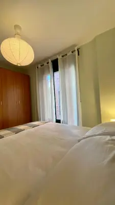 Cama o camas de una habitación en Casa Lima - Un apartamento familiar y acogedor