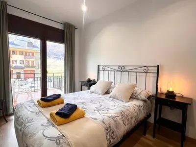 Cama o camas de una habitación en Apartaments Casa Mata - L'Amfitriona