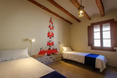 Cama o camas de una habitación en Masia el Carlos Private Pool - Cinema - AC - Game room