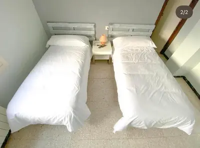 Cama o camas de una habitación en Hostal Pueblo Viejo