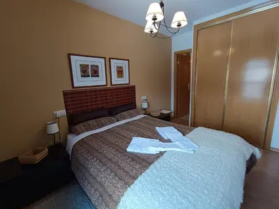 Cama o camas de una habitación en Inmocyma Cerler-Prados de Velarta A 3 3
