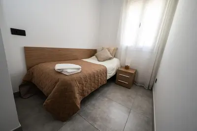 Cama o camas de una habitación en Apartamentos Alegre