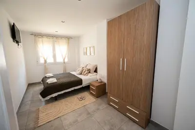 Cama o camas de una habitación en Apartamentos Alegre
