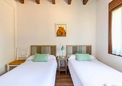 Cama o camas de una habitación en Casa Rural Orós
