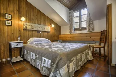 Cama o camas de una habitación en San Marsial Benasque Apart Hotel