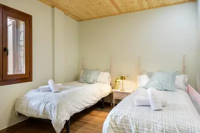 Cama o camas de una habitación en Estrella del Pirineo Castiello Jaca