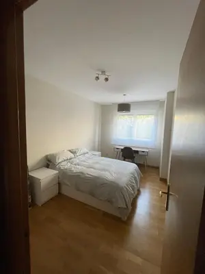 Cama o camas de una habitación en Duplex con jardín en Pamplona