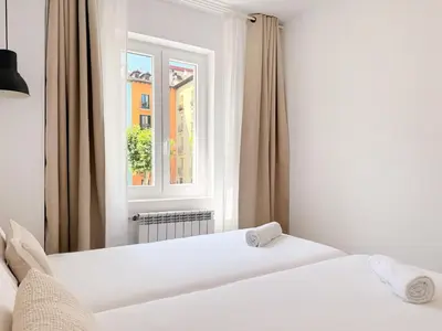 Cama o camas de una habitación en Santa Ana Plaza by Clabao