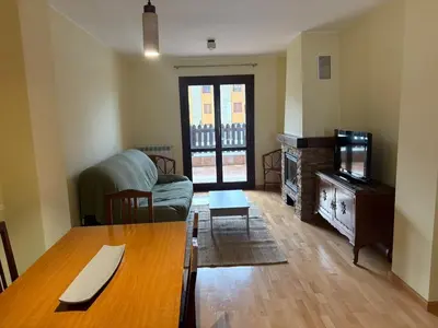 Una televisión o centro de entretenimiento en Apartamento con vistas Panticosa