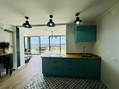 Una cocina o zona de cocina en Home Mirador Castellvell