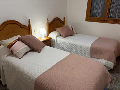 Cama o camas de una habitación en Hostal San José Naval