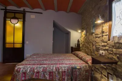 Cama o camas de una habitación en Casa Mossèn Batista