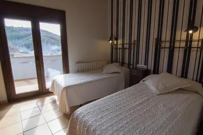 Cama o camas de una habitación en Casa Mossèn Batista