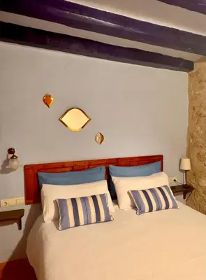 Cama o camas de una habitación en Cal Capdevila Apartaments