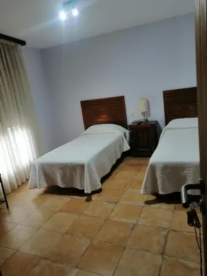 Cama o camas de una habitación en Hostal Bar Restaurante Villa Cerollera